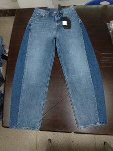 Women’s light-wash wide-leg jeans sample showing high-rise fit and five-pocket construction