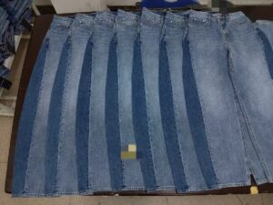 Light-wash wide-leg denim jeans production pieces prepared for private-label development