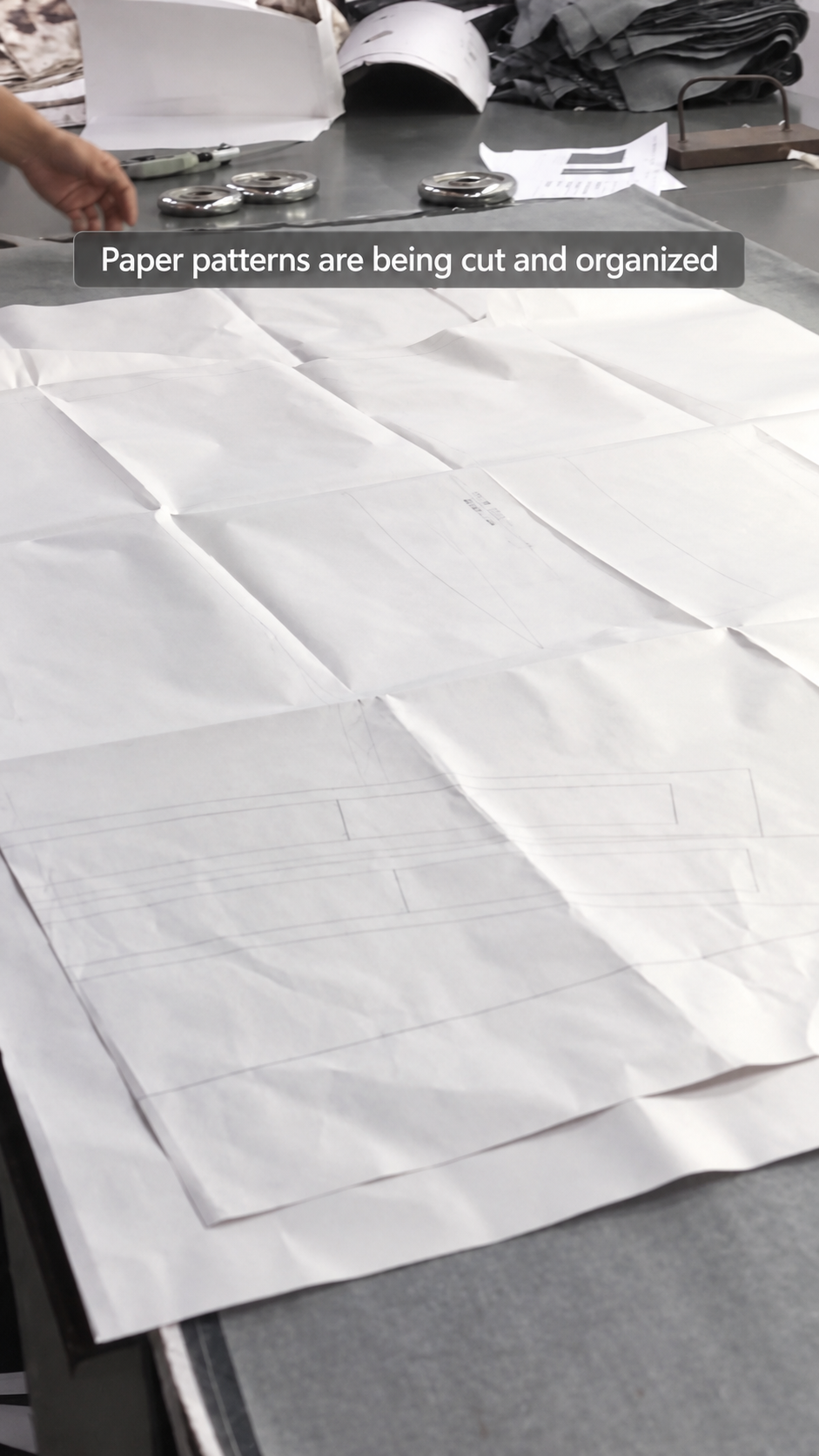 Production process evidence covering paper patterns, cutting preparation and garment construction steps.