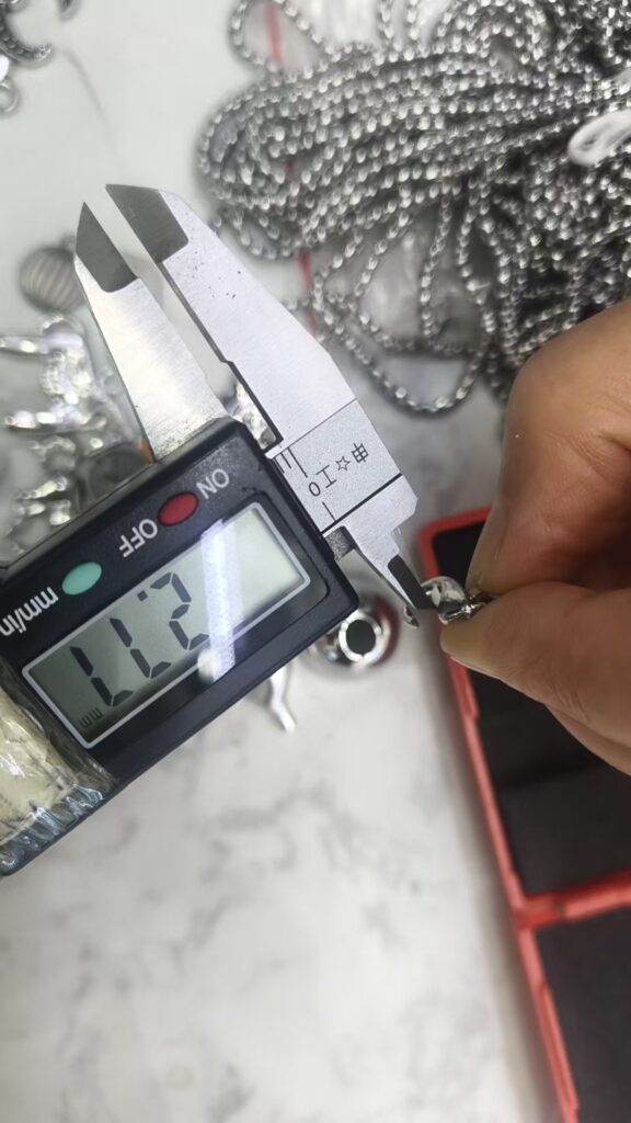 A separate chain candidate checked with a digital calliper
